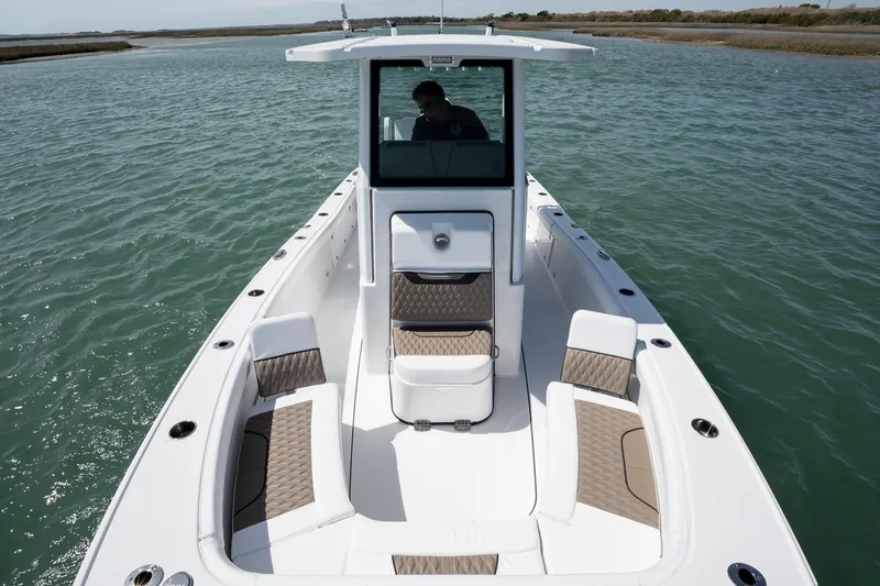 Slide: The Image of 2025 Blackfin 262 HB boat on water, featuring spacious seating and sleek design. - 9