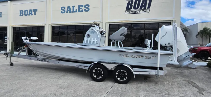 Slide: The Image of 2023 Blazer Bay 2420 GTS boat on trailer outside dealership. - 3