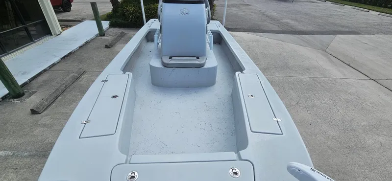 Slide: The Image of 2023 Blazer Bay 2420 GTS boat interior, showcasing spacious deck and seating area. - 14