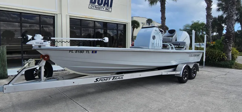Slide: The Image of 2023 Blazer Bay 2420 GTS boat on trailer outside dealership. - 4