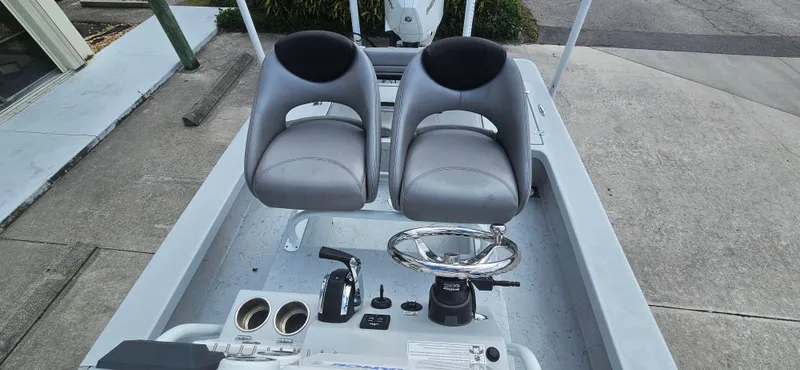 Slide: The Image of 2023 Blazer Bay 2420 GTS boat interior with dual seats and steering console. - 19