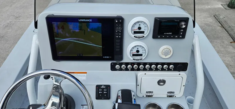 Slide: The Image of 2023 Blazer Bay 2420 GTS boat dashboard with navigation and control instruments. - 10