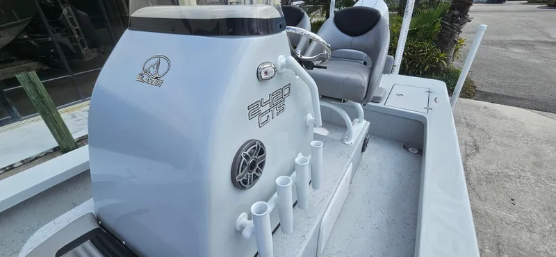Slide: The Image of 2023 Blazer Bay 2420 GTS boat console with seating and rod holders. - 16