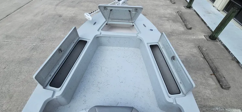 Slide: The Image of 2023 Blazer Bay 2420 GTS boat interior with open storage compartments. - 12