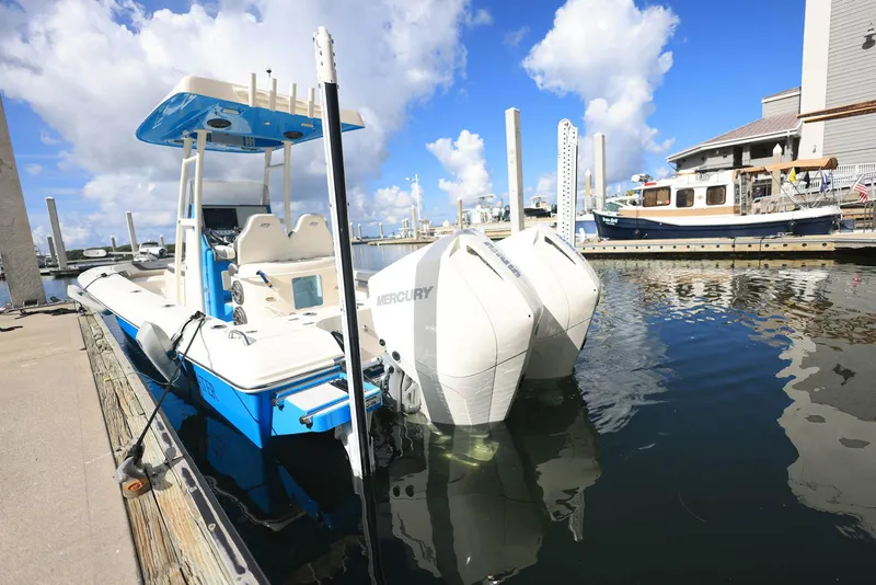The Image of 2021 ShearWater 27 Carolina boat docked at marina with twin Mercury engines. - 0