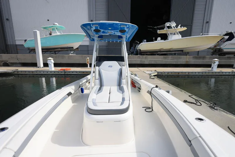 Slide: The Image of 2021 ShearWater 27 Carolina boat docked at marina, featuring sleek design and modern seating. - 15