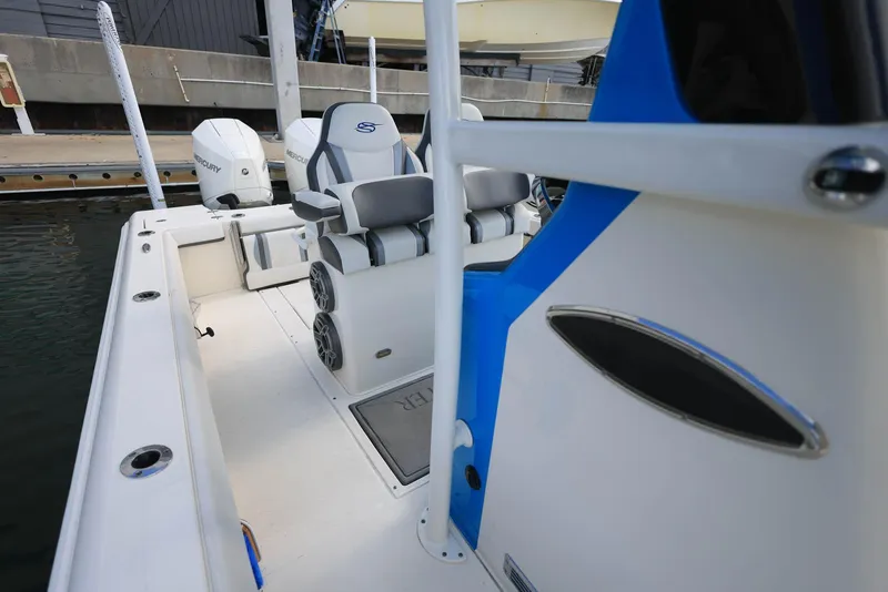 Slide: The Image of 2021 ShearWater 27 Carolina boat interior with seating and modern design. - 25