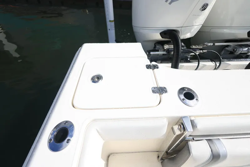 Slide: The Image of 2021 ShearWater 27 Carolina boat deck with engine and storage compartment. - 28