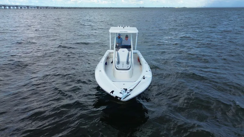 Slide: The Image of 2021 ShearWater 27 Carolina boat on open water, viewed from the front. - 3