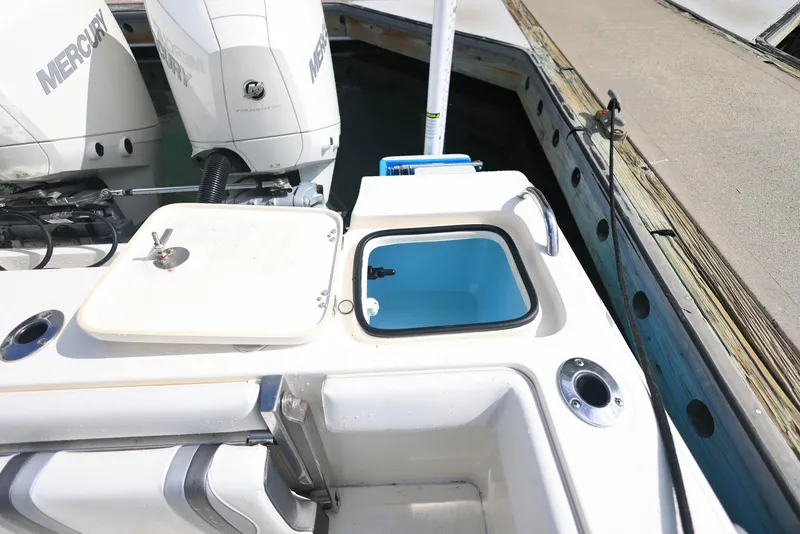 Slide: The Image of 2021 ShearWater 27 Carolina boat with Mercury engines, docked, featuring a livewell. - 31