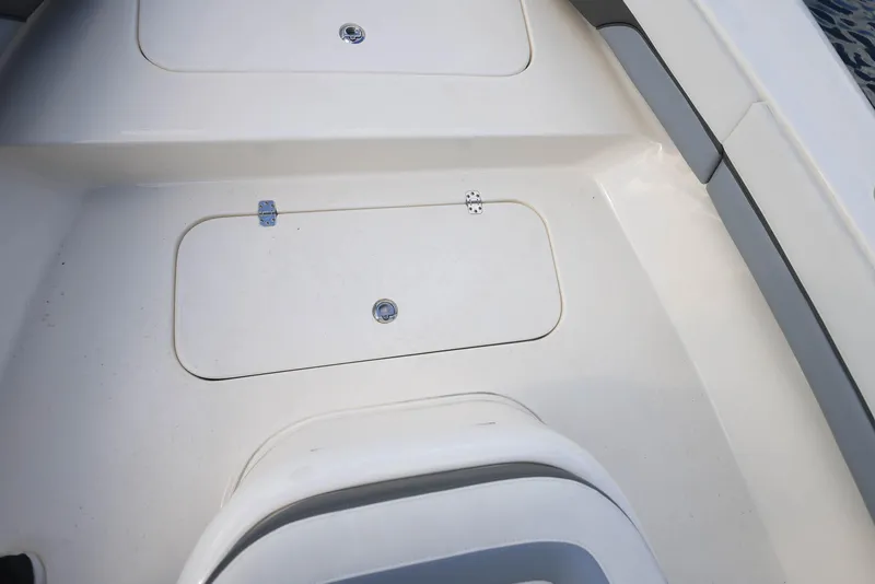 Slide: The Image of 2021 ShearWater 27 Carolina boat deck with storage compartments. - 32