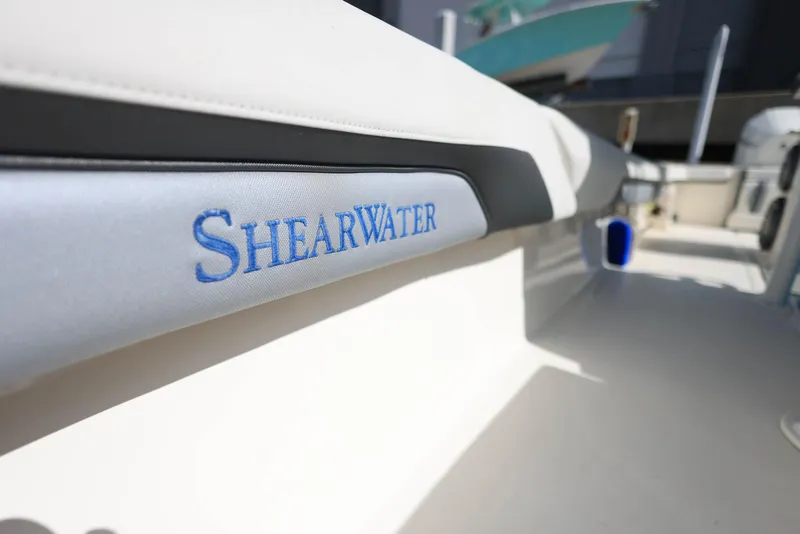 Slide: The Image of 2021 ShearWater 27 Carolina boat interior with logo detail. - 37
