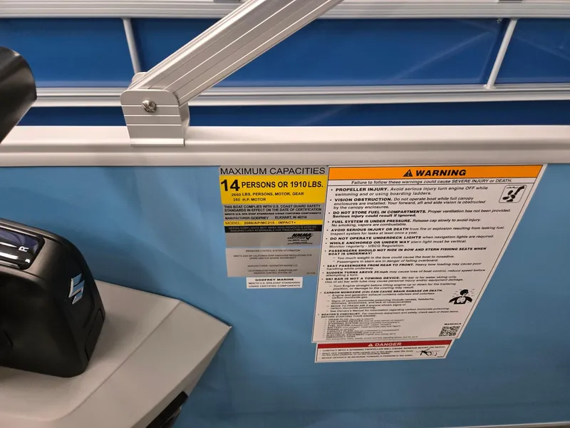 Slide: The Image of Capacity warning label on 2025 Godfrey Sweetwater 2086 C boat, indicating 14 persons or 1910 lbs. - 12