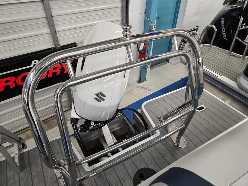 Slide: The Image of 2025 Godfrey Sweetwater 2086 C boat with Suzuki outboard motor and stainless steel railing. - 16