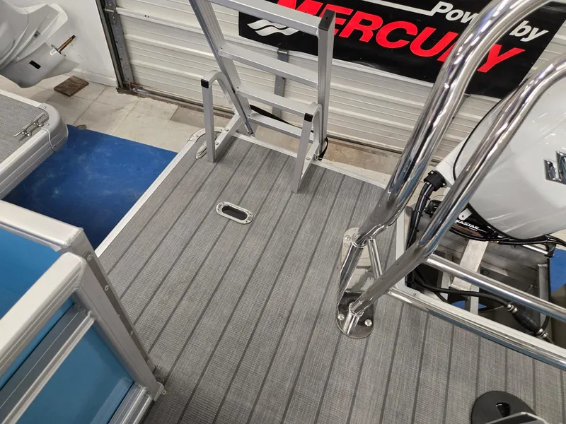 Slide: The Image of 2025 Godfrey Sweetwater 2086 C boat deck with ladder and Mercury engine. - 18