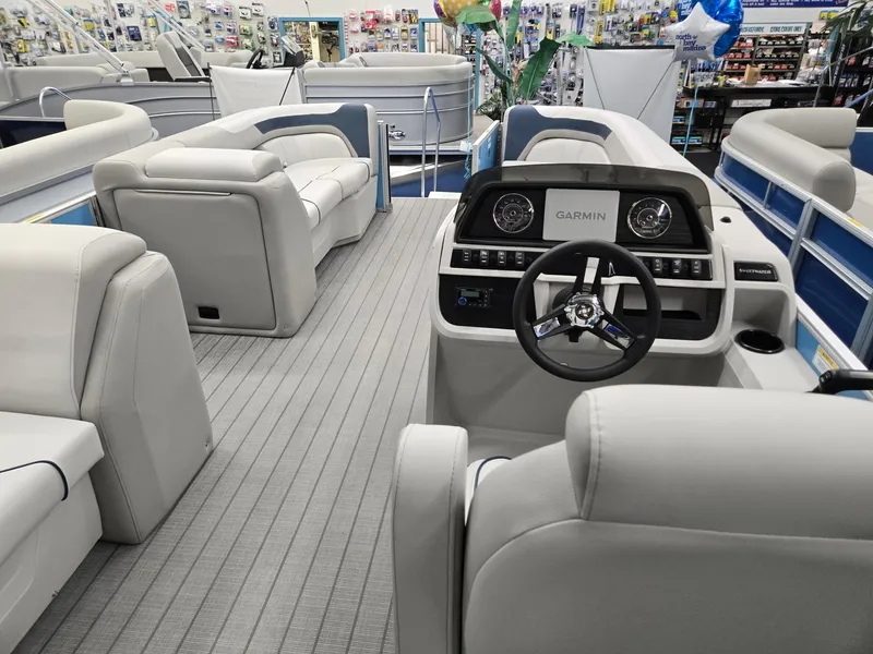Slide: The Image of 2025 Godfrey Sweetwater 2086 C pontoon boat interior with modern seating and Garmin dashboard. - 22