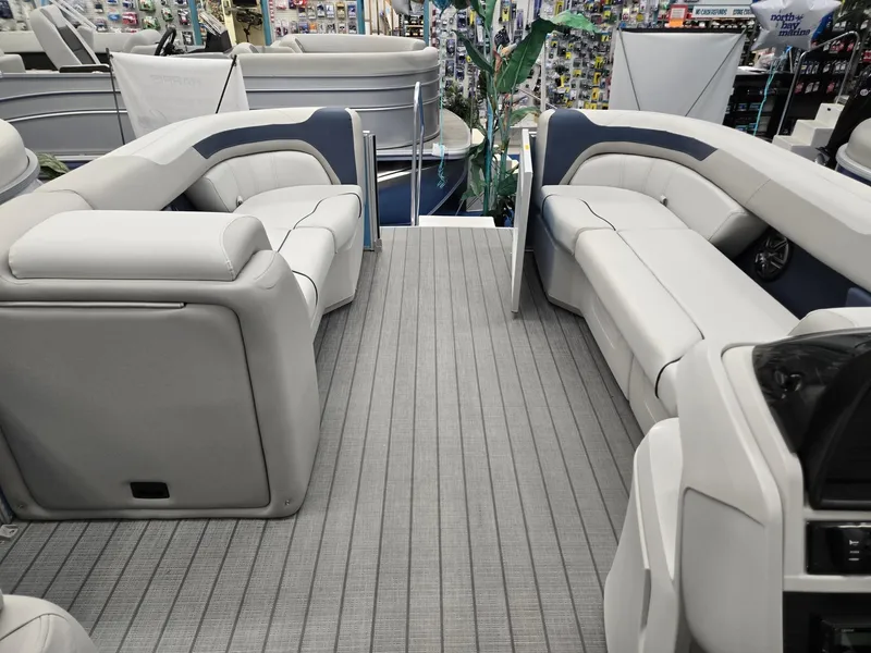 Slide: The Image of 2025 Godfrey Sweetwater 2086 C pontoon boat interior with plush seating and modern design. - 23