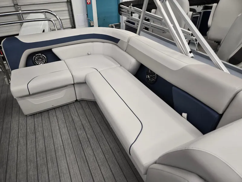 Slide: The Image of 2025 Godfrey Sweetwater 2086 C boat interior with plush seating and modern design. - 7