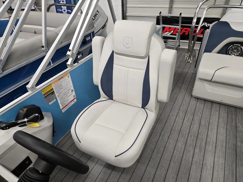 Slide: The Image of 2025 Godfrey Sweetwater 2086 C boat seat, white and blue, in a modern interior setting. - 8