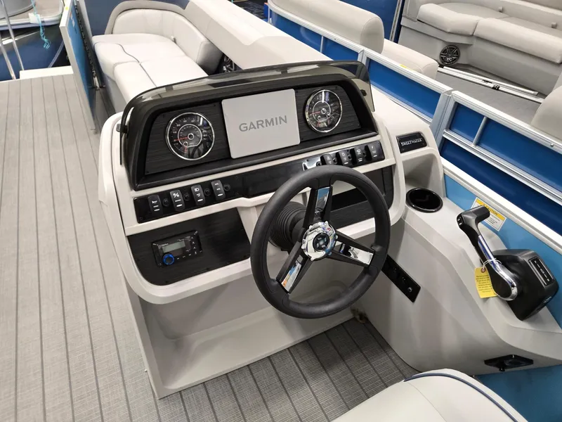 Slide: The Image of 2025 Godfrey Sweetwater 2086 C boat dashboard with Garmin display and steering wheel. - 9