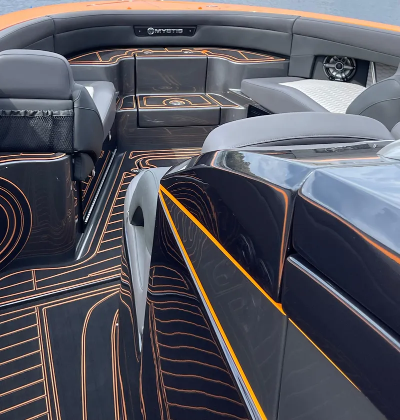 Slide: The Image of 2023 Mystic Powerboats M3800 interior with sleek design and modern seating. - 7