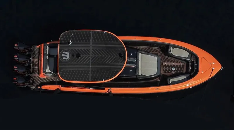 Slide: The Image of 2023 Mystic Powerboats M3800, sleek orange design, top view, luxury performance boat. - 8