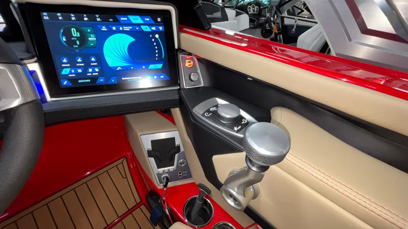 Slide: The Image of 2025 MasterCraft X24 boat interior with touchscreen controls and modern dashboard design. - 26