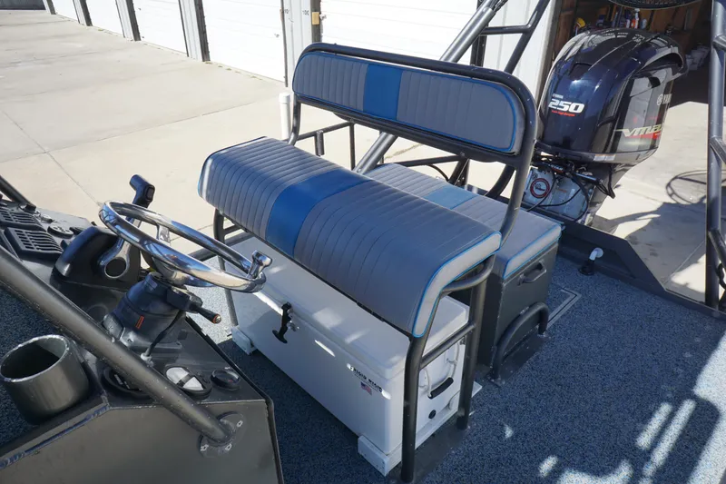 Slide: The Image of 2016 Boat Right 25'8'' Custom Flat interior with seating and steering wheel. - 11