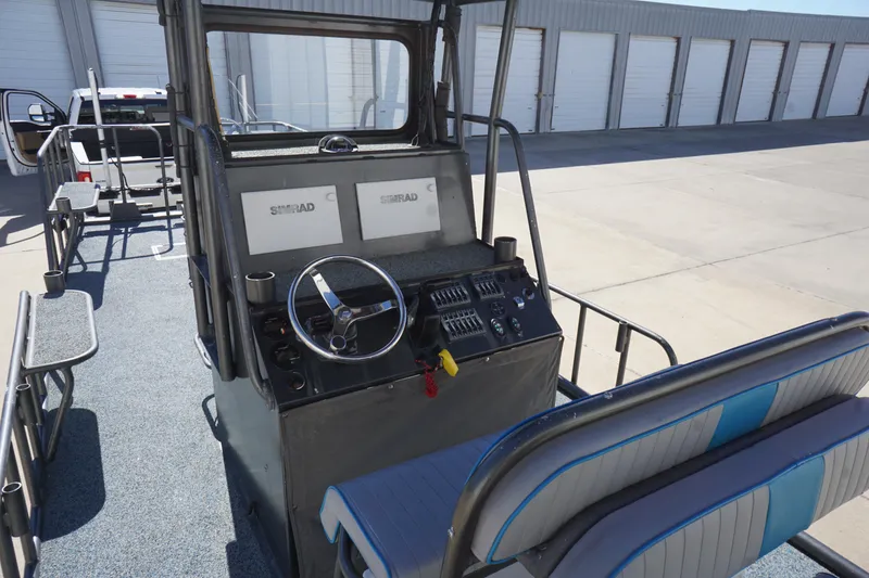 Slide: The Image of 2016 Boat Right 25'8'' Custom Flat, interior view with steering console and seating. - 12