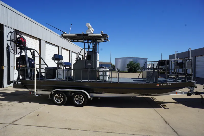 Slide: The Image of 2016 Boat Right 25'8'' Custom Flat boat on trailer, parked outdoors. - 4