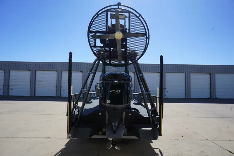 Slide: The Image of 2016 Boat Right 25'8'' Custom Flat airboat with powerful engine, parked outdoors. - 6