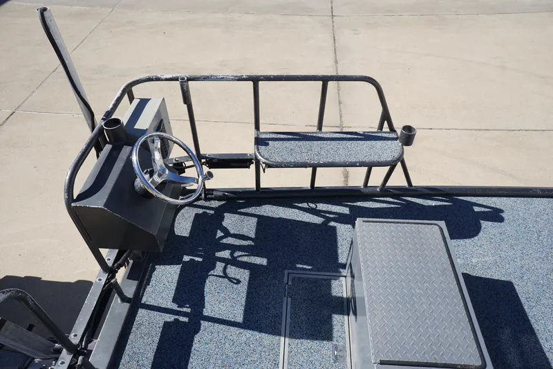 Slide: The Image of 2016 Boat Right 25'8'' Custom Flat deck with steering wheel and seating. - 9