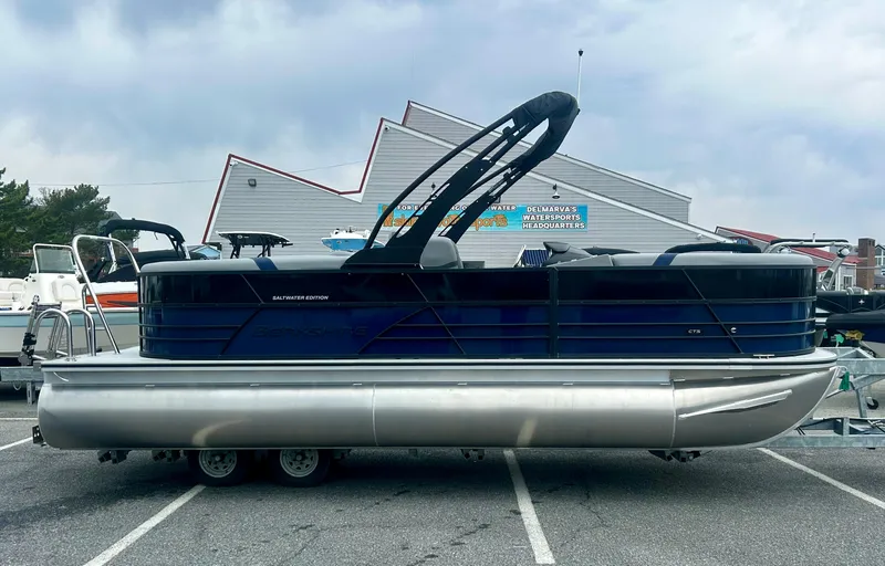 The Image of 2025 Berkshire 22RFX ARCH CTS 2.75 pontoon boat on trailer, parked outdoors. - 0