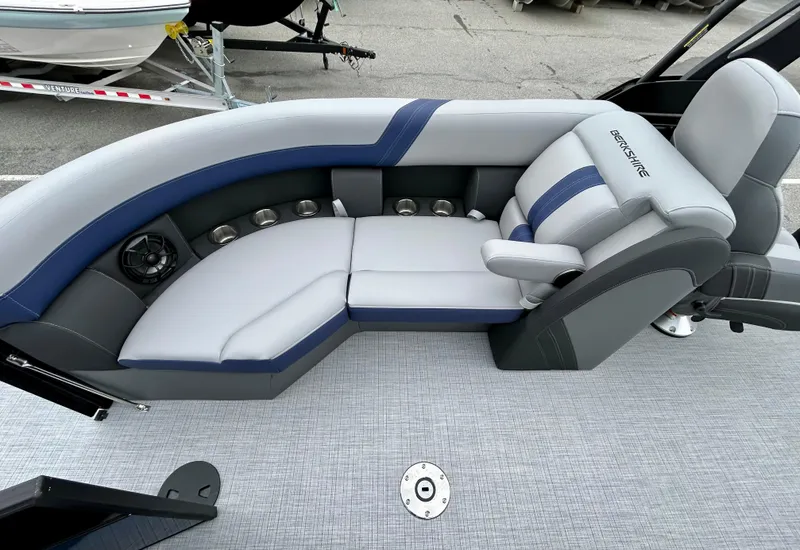 Slide: The Image of 2025 Berkshire 22RFX ARCH CTS 2.75 boat interior with gray and blue seating. - 12