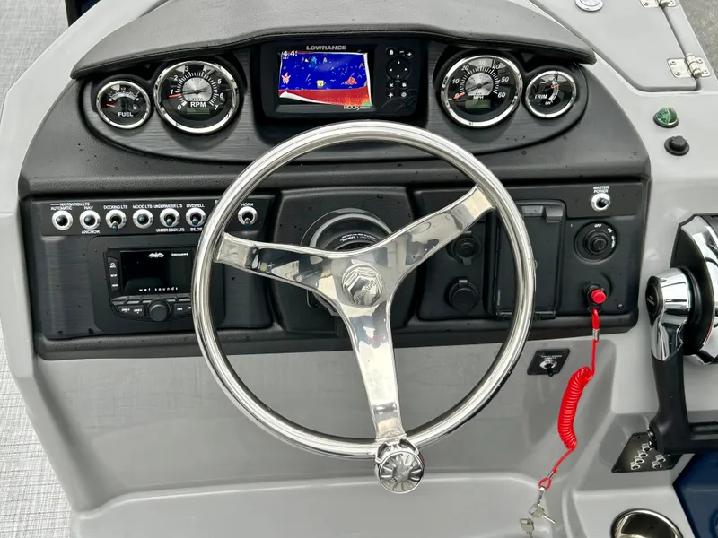 Slide: The Image of Dashboard of 2025 Berkshire 22RFX ARCH CTS 2.75 boat with steering wheel and gauges. - 14