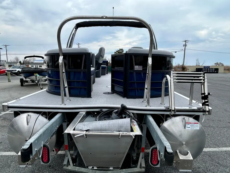 Slide: The Image of 2025 Berkshire 22RFX ARCH CTS 2.75 pontoon boat, rear view in parking lot. - 15