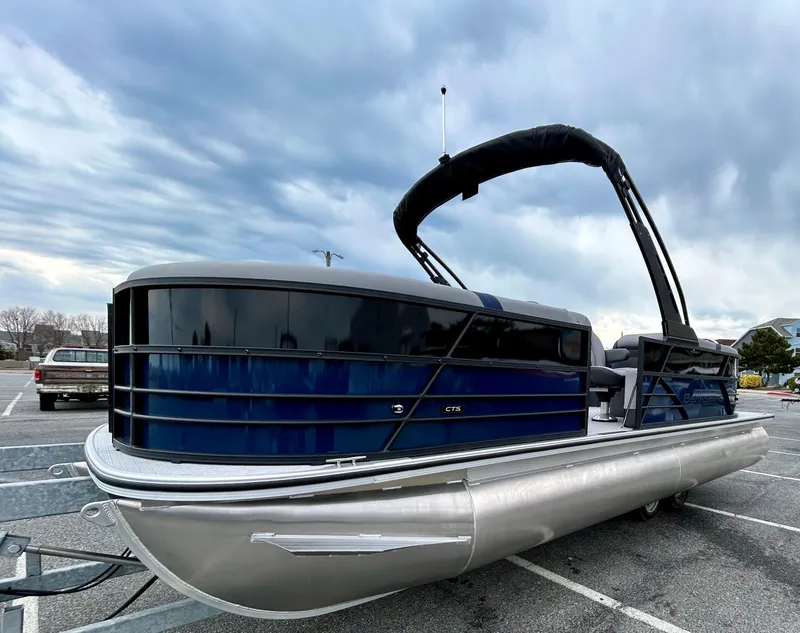 Slide: The Image of 2025 Berkshire 22RFX ARCH CTS 2.75 pontoon boat in parking lot, cloudy sky background. - 5