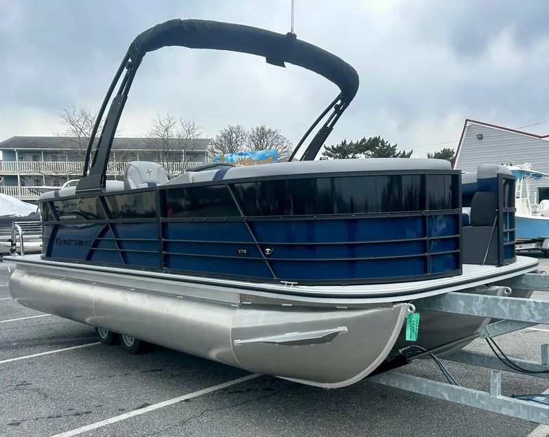 Slide: The Image of 2025 Berkshire 22RFX ARCH CTS 2.75 pontoon boat on trailer, parked outdoors. - 6