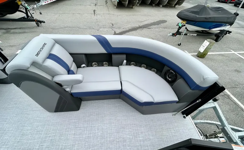 Slide: The Image of 2025 Berkshire 22RFX ARCH CTS 2.75 boat interior with gray and blue seating. - 9