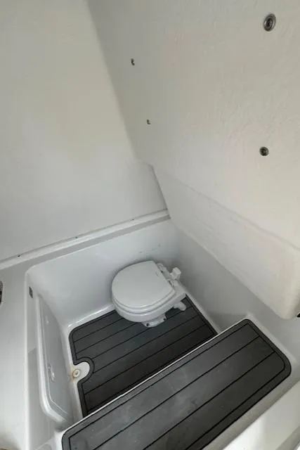 Slide: The Image of 2025 Cape Horn 31T boat interior with compact marine toilet. - 13
