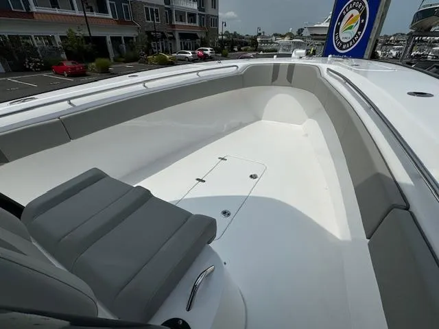 Slide: The Image of 2025 Cape Horn 31T boat interior with sleek seating and spacious deck design. - 11