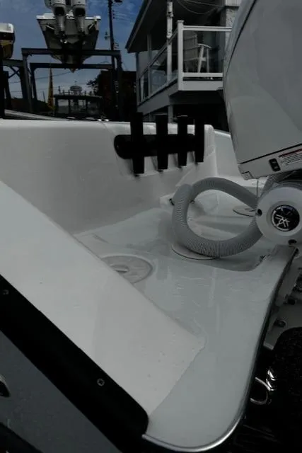 Slide: The Image of 2025 Cape Horn 31T boat deck with motor and rod holders. - 9