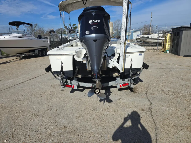 Slide: The Image of 2016 NauticStar 227 XTS boat in a marina, showcasing storage compartments. - 3