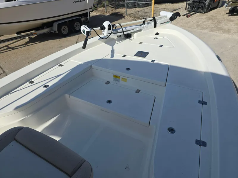 Slide: The Image of 2016 NauticStar 227 XTS boat deck with storage compartments and fishing rod holders. - 6