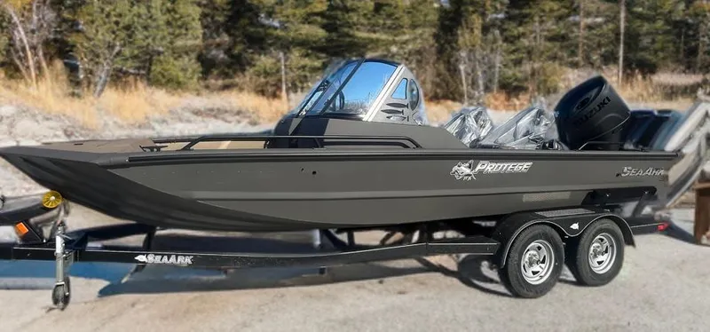 The Image of 2025 SeaArk Protege boat on trailer, sleek design, outdoors setting. - 0