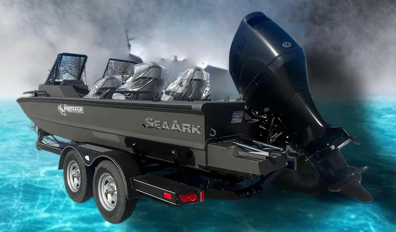 Slide: The Image of 2025 SeaArk Protege boat on trailer, featuring powerful outboard motor, set against a dynamic water background. - 1