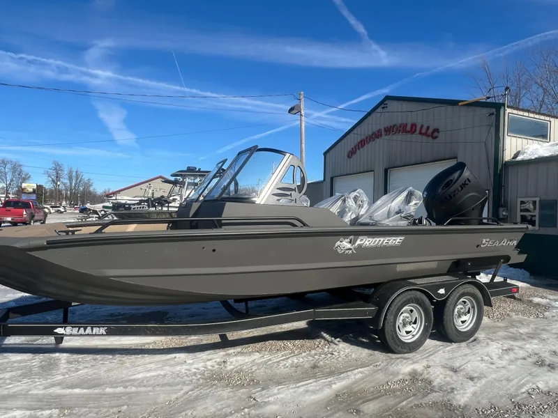 Slide: The Image of 2025 SeaArk Protege 200 boat on trailer, featuring Suzuki outboard motor. - 2
