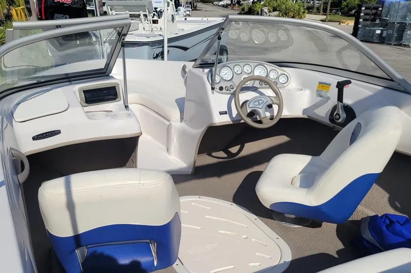 Slide: The Image of 2007 Tahoe Q4 L boat interior with steering wheel and seating. - 4