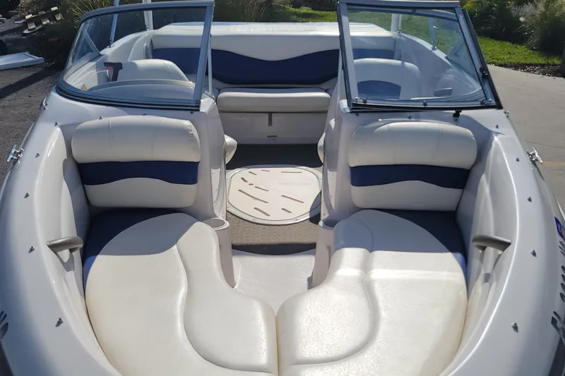 Slide: The Image of 2007 Tahoe Q4 L boat interior with white and blue seating. - 5