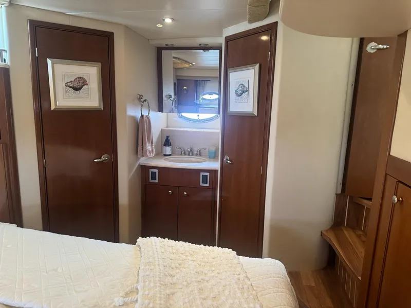 Slide: The Image of Luxurious interior of 2005 Meridian 459 Motoryacht with wood finishes and elegant decor. - 12
